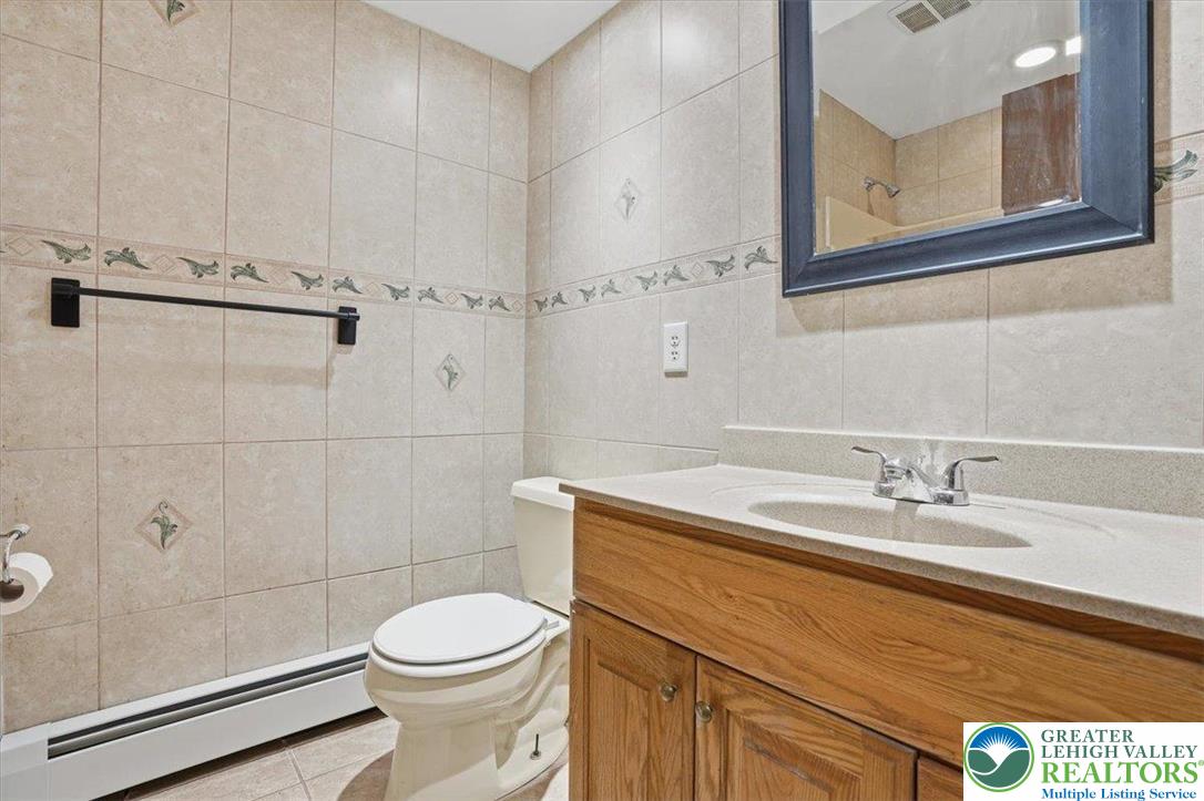 401 Highland Hill Road Jim Thorpe, PA 18235 - Photo 25 of 71 a bathroom with a sink a toilet and shower