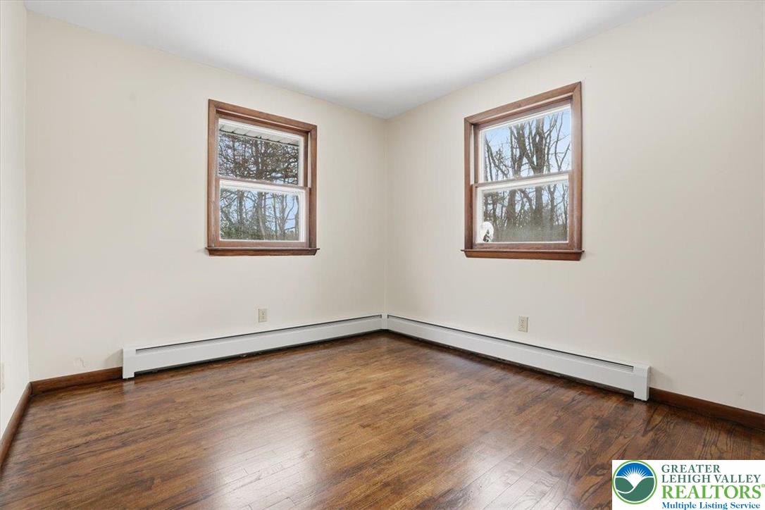 401 Highland Hill Road Jim Thorpe, PA 18235 - Photo 27 of 71 a view of an empty room with wooden floor and a window
