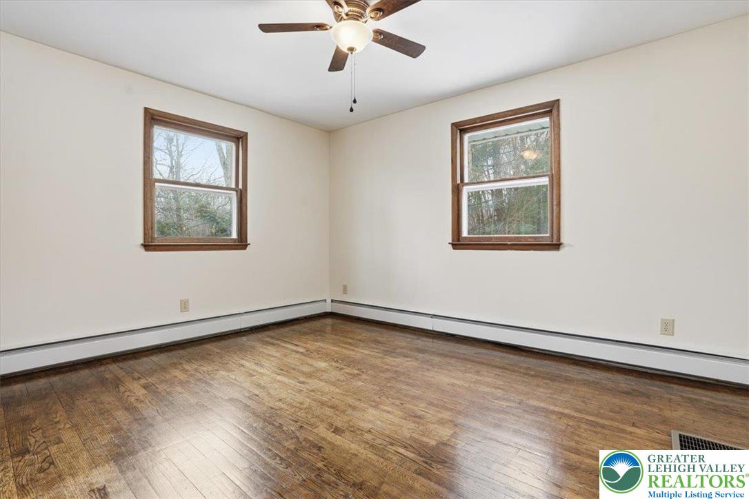 401 Highland Hill Road Jim Thorpe, PA 18235 - Photo 28 of 71 a view of an empty room with a window and wooden floor