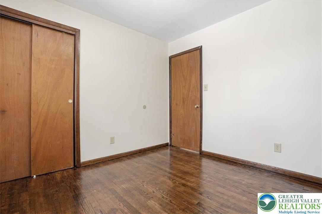 401 Highland Hill Road Jim Thorpe, PA 18235 - Photo 32 of 71 an empty room with wooden floor and windows