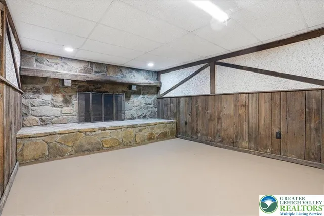a view of a chairs and table in the back yard of the house
