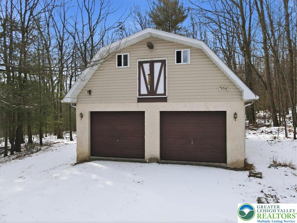 401 Highland Hill Road Jim Thorpe, PA 18235 - Photo 50 of 71 a front view of a house with a yard and garage