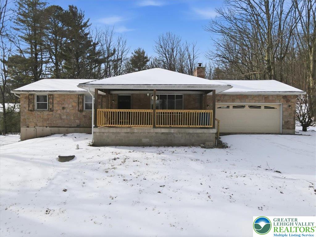 401 Highland Hill Road Jim Thorpe, PA 18235 - Photo 6 of 71 a front view of a house with a yard