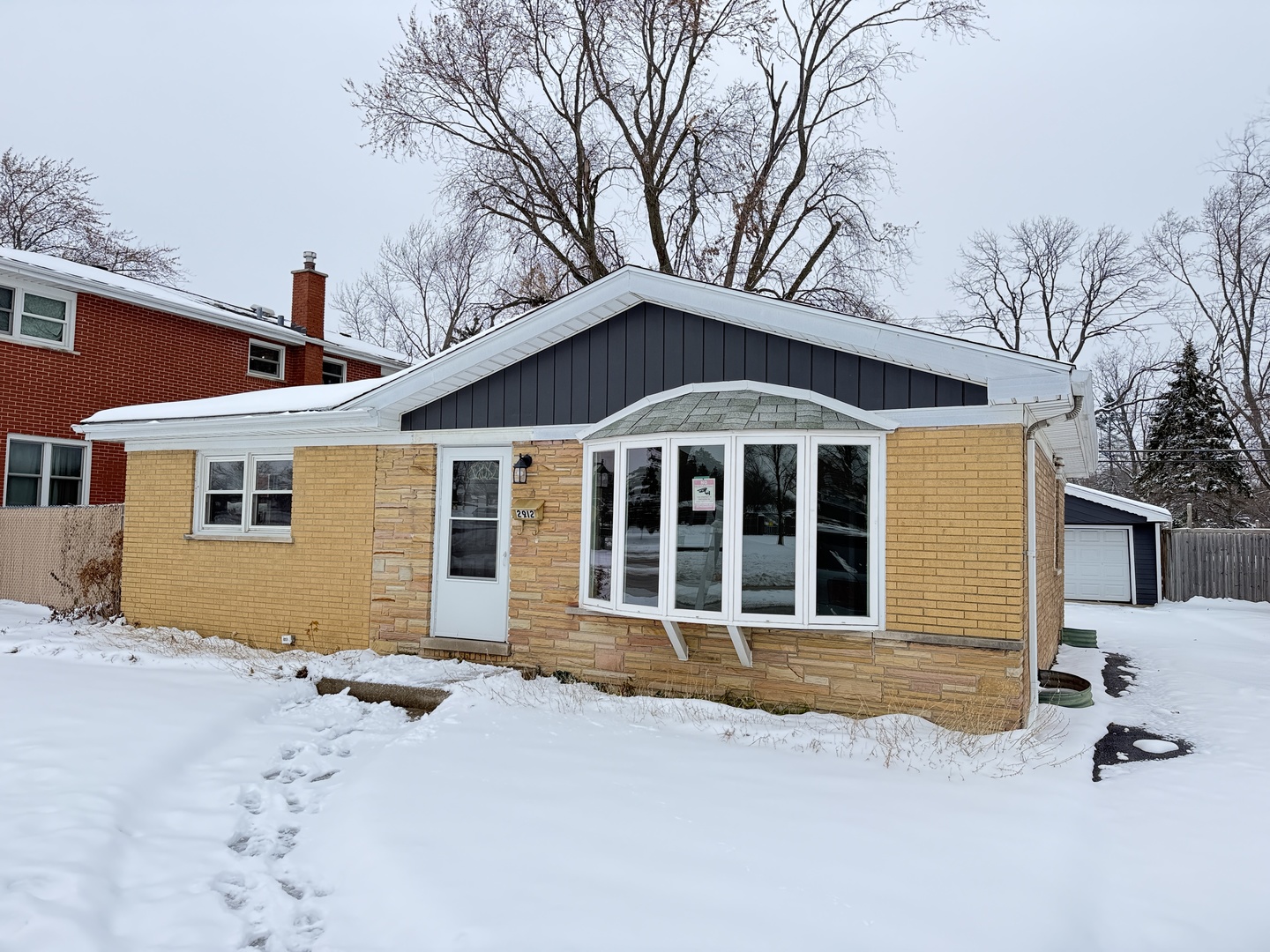 2912 175th Street Hazel Crest, IL 60429 - Photo 1 of 13 a front view of a house with a yard