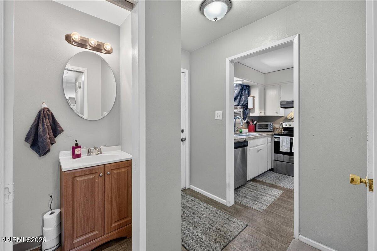 5 Smithridge Park Reno, NV 89502 - Photo 10 of 24 a room with a walk in closet and wooden floor