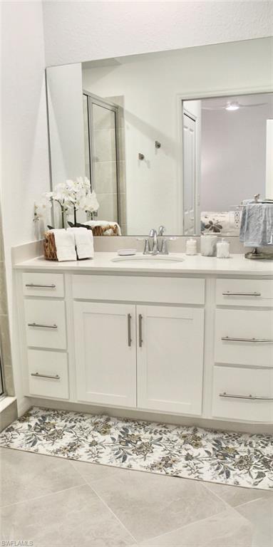 15405 Grn Acrs Avenue, Unit 2341 Babcock Ranch, FL 33982 - Photo 14 of 28 a bathroom with a sink vanity and mirror