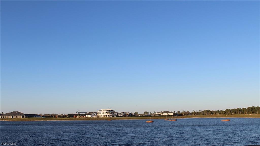 15405 Grn Acrs Avenue, Unit 2341 Babcock Ranch, FL 33982 - Photo 21 of 28 a view of a lake and mountain