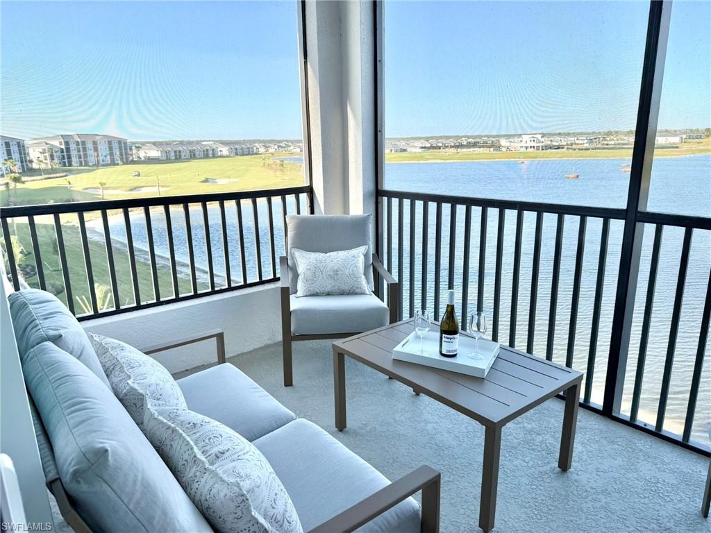 15405 Grn Acrs Avenue, Unit 2341 Babcock Ranch, FL 33982 - Photo 5 of 28 a balcony view with a seating space