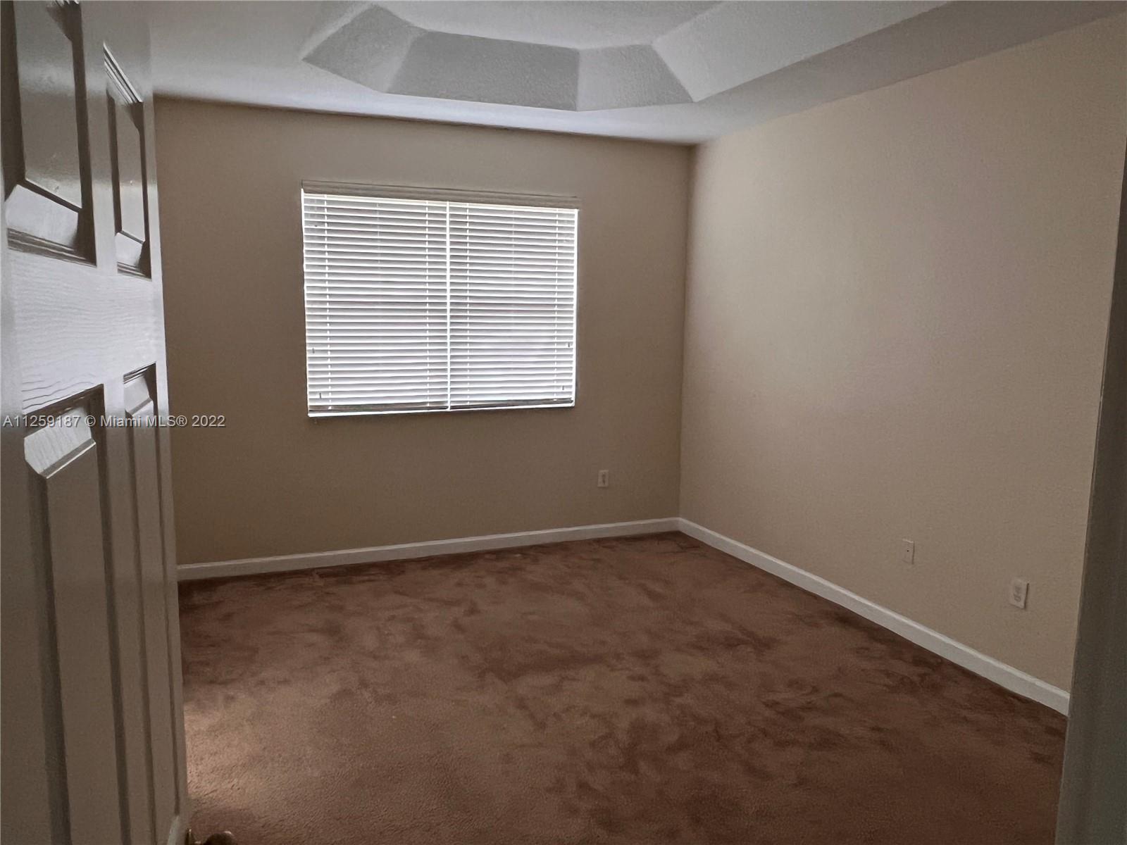 Three Lakes Miami, FL 33186 - Photo 19 of 23 an empty room with a window