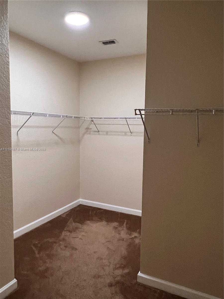 Three Lakes Miami, FL 33186 - Photo 20 of 23 a view of a room with racks on the wall