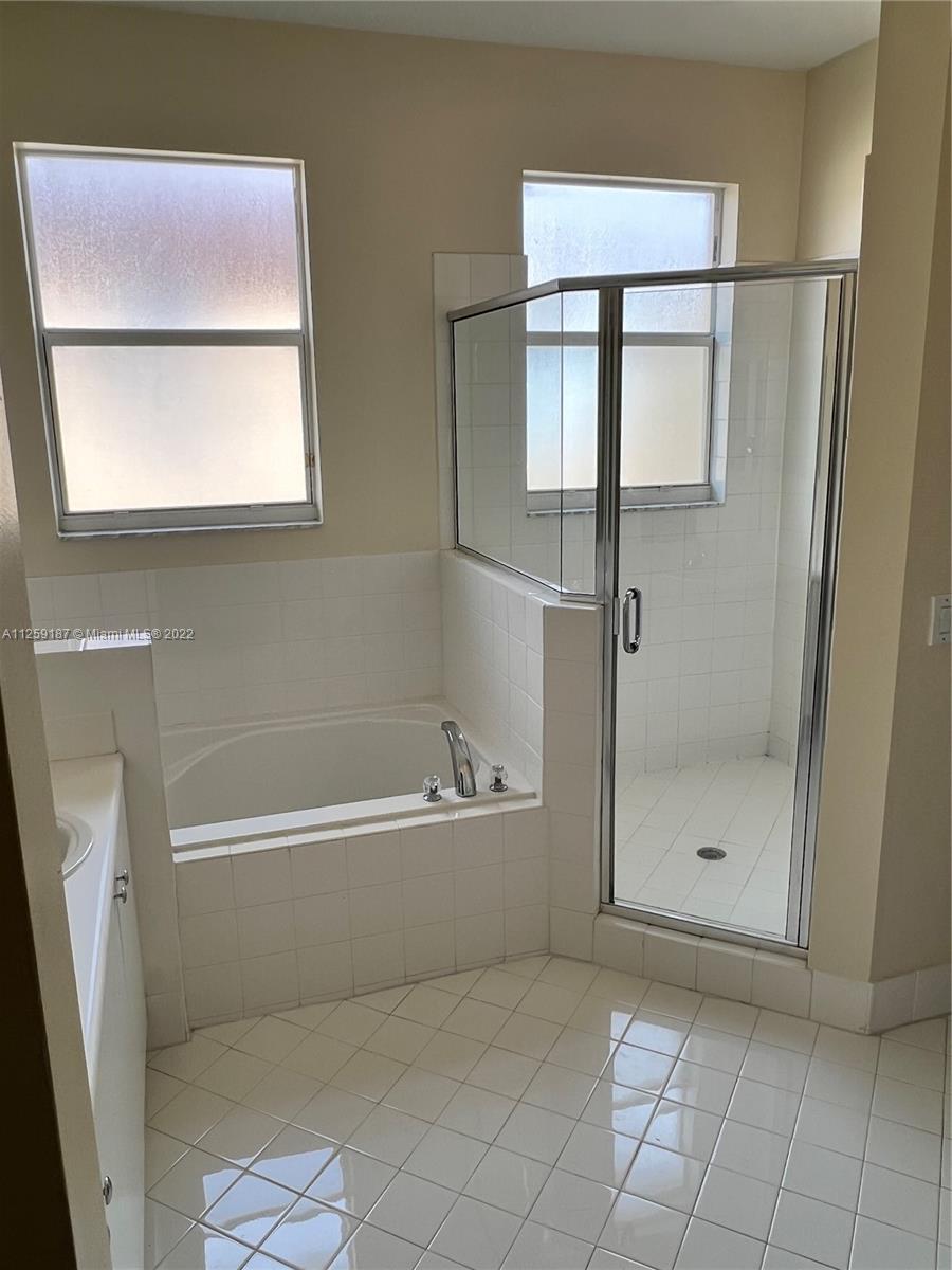 Three Lakes Miami, FL 33186 - Photo 22 of 23 a bathroom with a bathtub and a shower