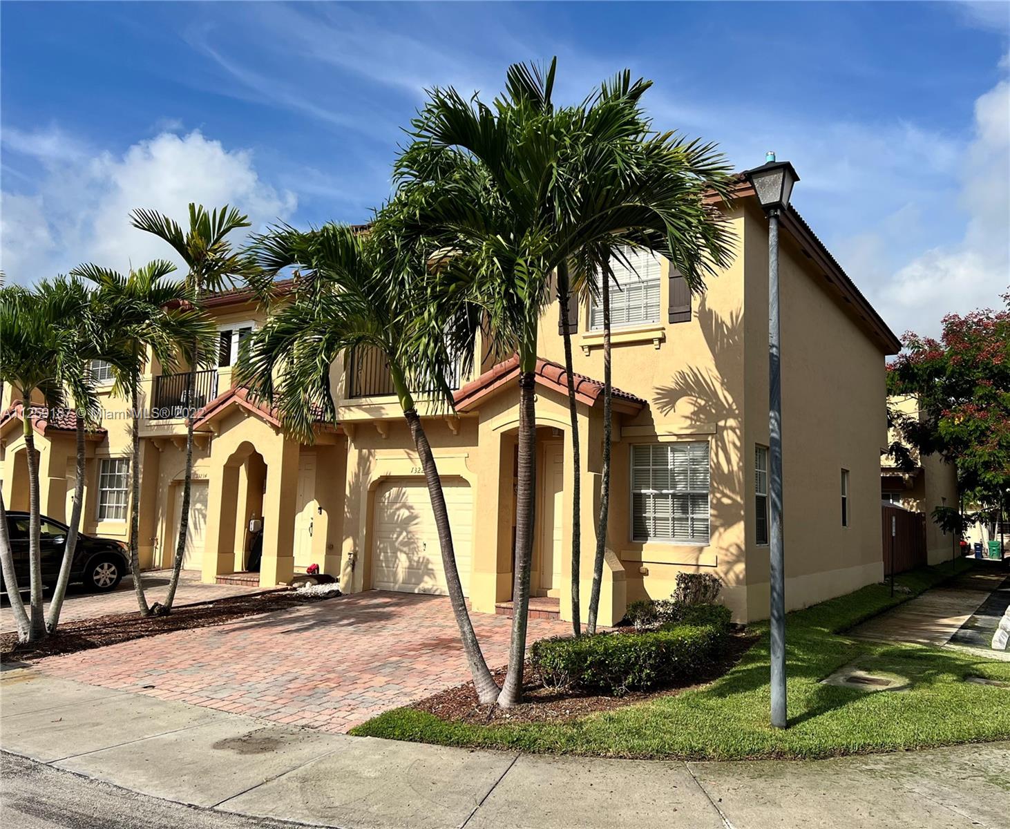 Three Lakes Miami, FL 33186 - Photo 3 of 23 a front view of a house with garden
