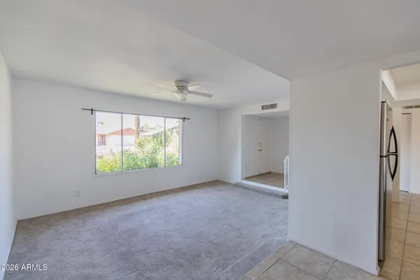 a kitchen with stainless steel appliances kitchen island a refrigerator sink and stove