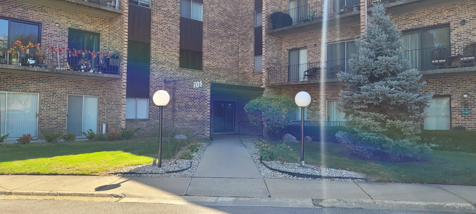 701 West Huntington Commons Road, Unit 405 Mount Prospect, IL 60056 - Photo 3 of 36 a view of brick walls of the house