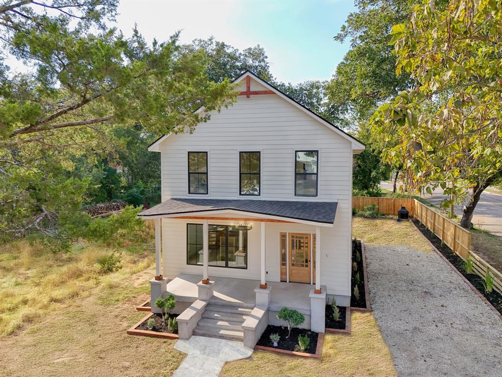 718 Tyler Street Waco, TX 76704 - Photo 1 of 39 a front view of a house with garden