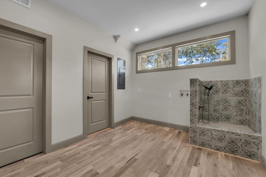 718 Tyler Street Waco, TX 76704 - Photo 11 of 39 a view of livingroom with hardwood floor and hallway
