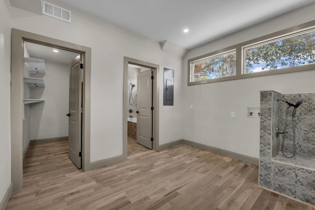 718 Tyler Street Waco, TX 76704 - Photo 12 of 39 wooden floor in an empty room