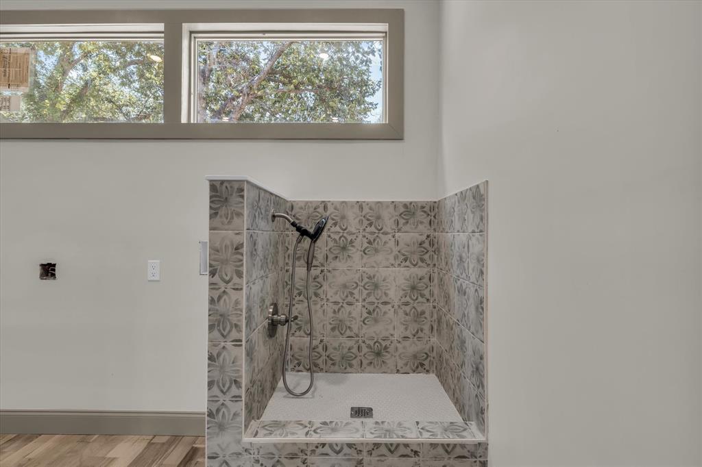718 Tyler Street Waco, TX 76704 - Photo 13 of 39 a bathroom with a shower