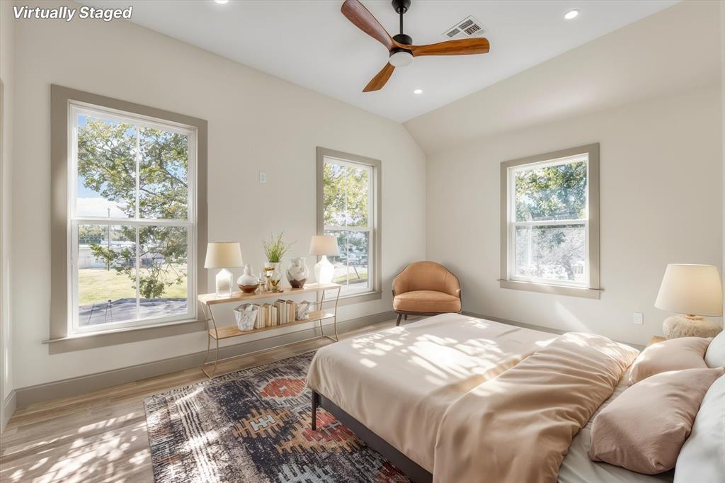 718 Tyler Street Waco, TX 76704 - Photo 18 of 39 a bedroom with a large bed and a window