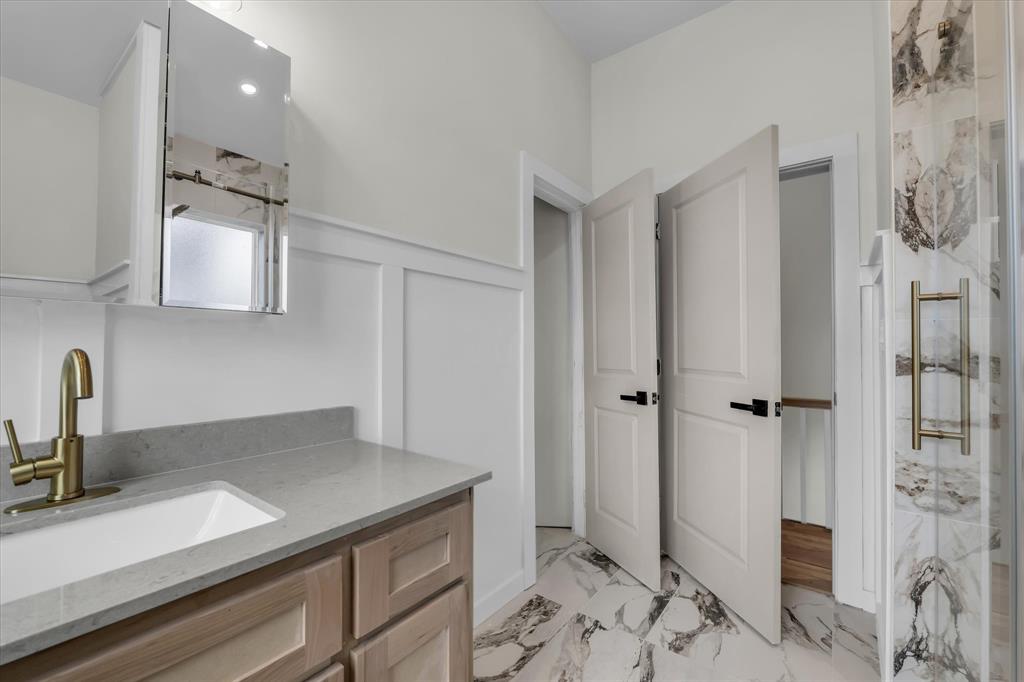718 Tyler Street Waco, TX 76704 - Photo 23 of 39 a kitchen with a sink and a refrigerator
