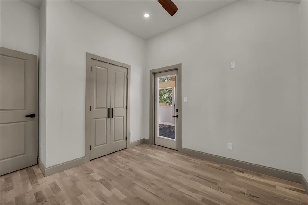 718 Tyler Street Waco, TX 76704 - Photo 28 of 39 an empty room with closet and wooden floor