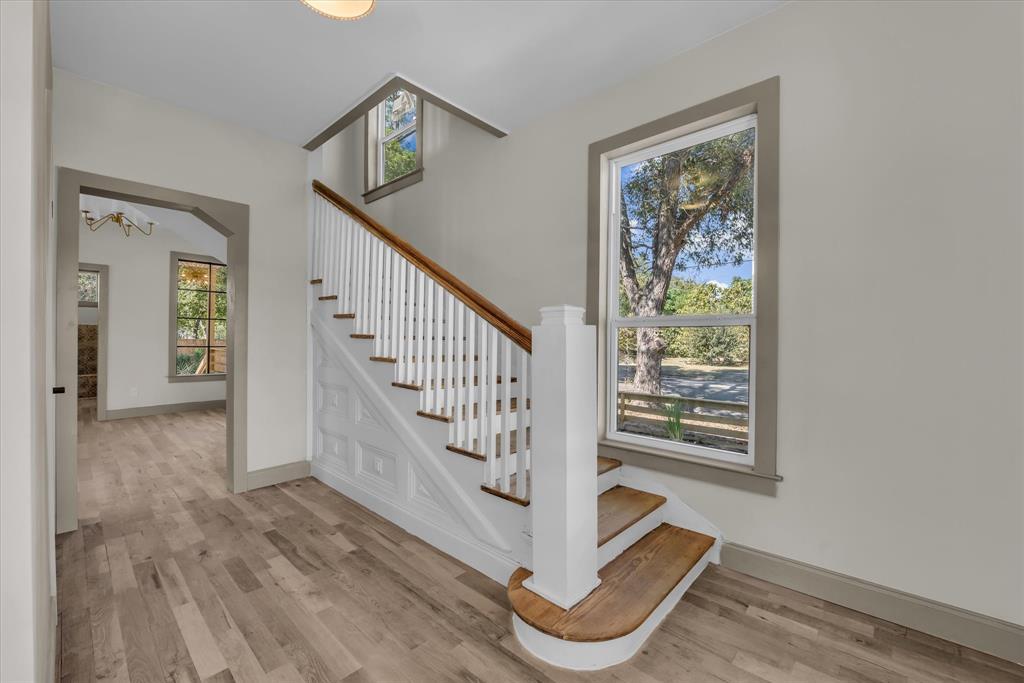 718 Tyler Street Waco, TX 76704 - Photo 5 of 39 a view of entryway with stairs and wooden floor