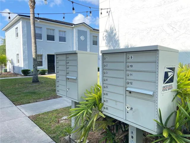 a view of outdoor space with signage and flags