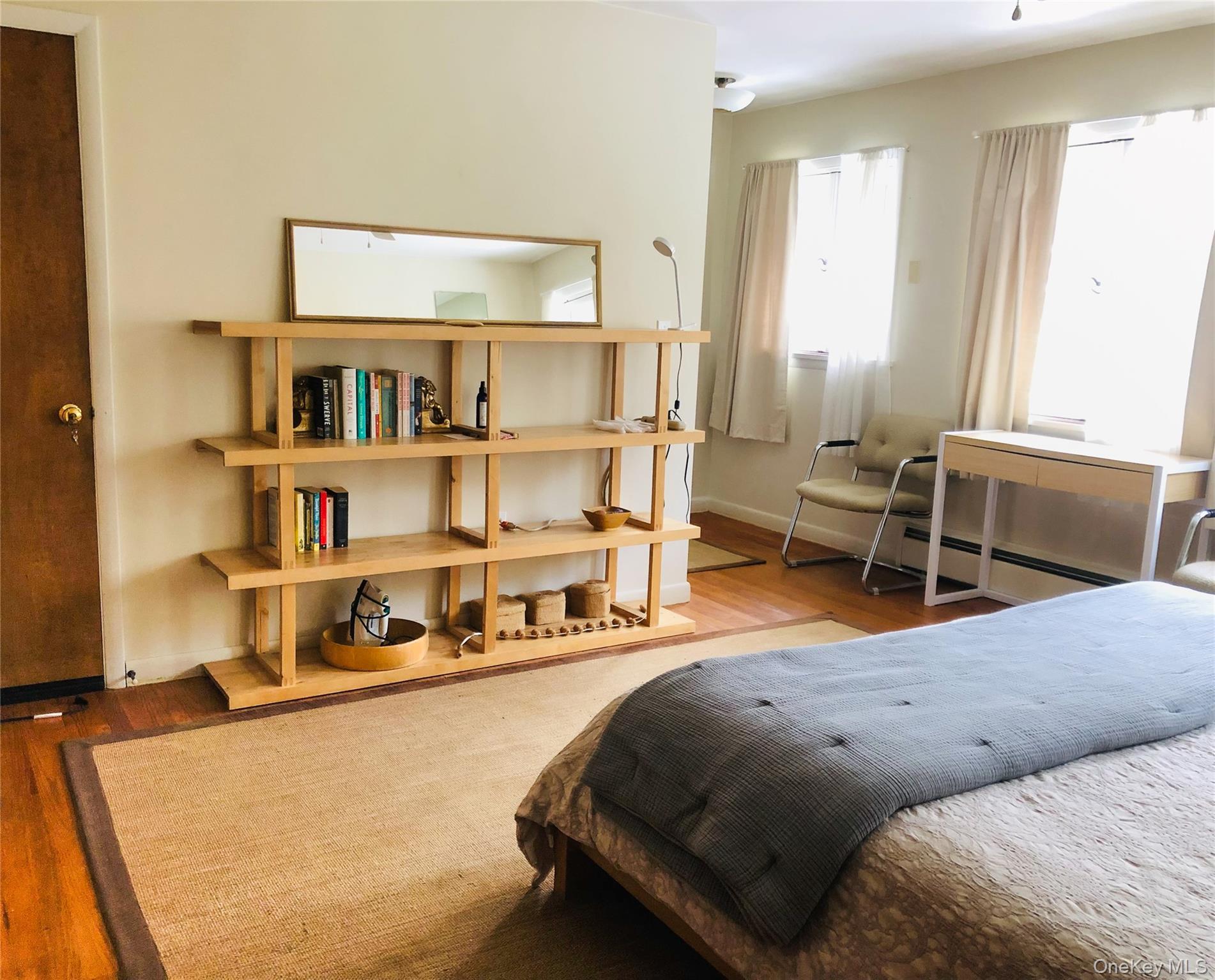 68-78 Ridge Road Clinton Corners, NY 12514 - Photo 24 of 50 a living room with furniture and a book shelf