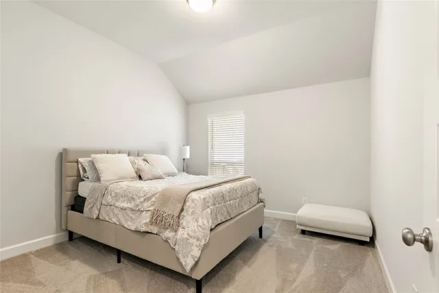 a white bath tub sitting in a en suite bathroom