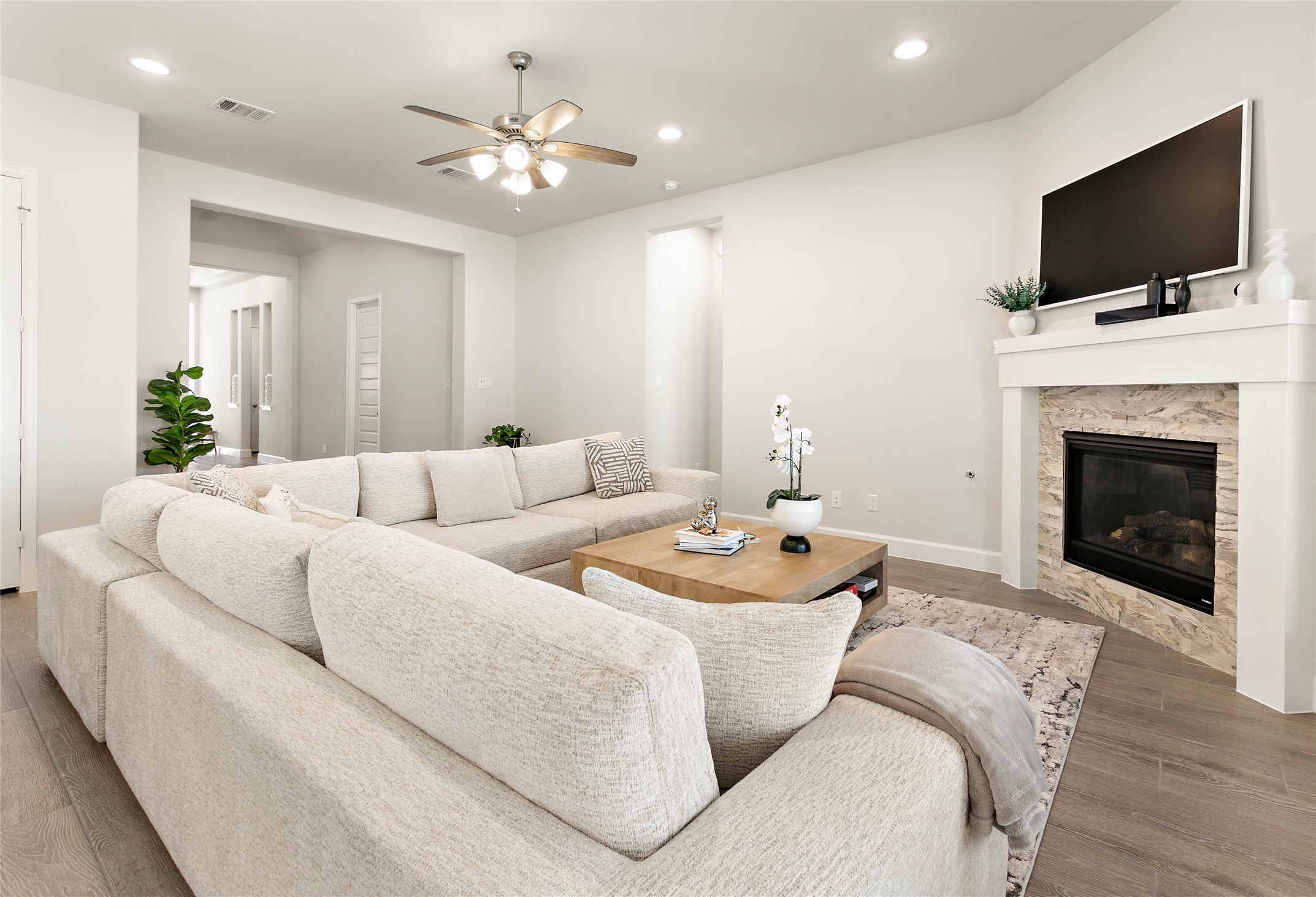 508 Stella Beth Way Montgomery, TX 77316 - Photo 7 of 27 a living room with furniture a flat screen tv and a fireplace