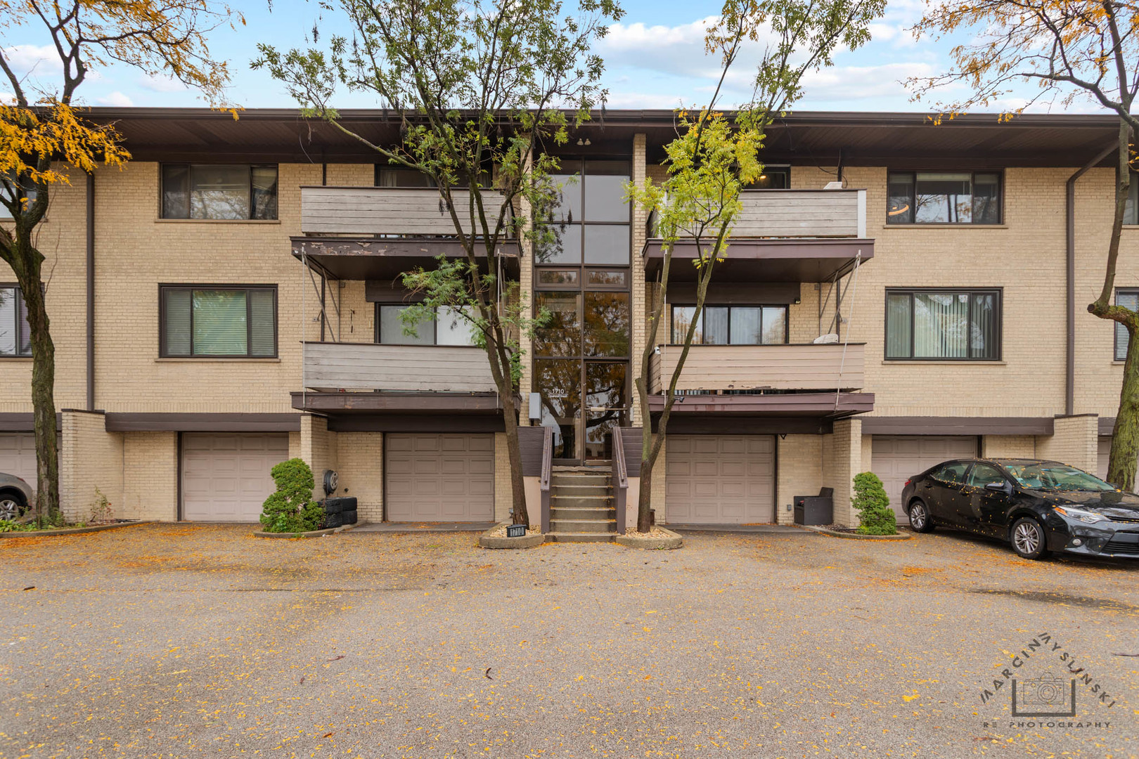 1710 Dempster Street, Unit C Park Ridge, IL 60068 - Photo 1 of 1 a front view of a house with parking