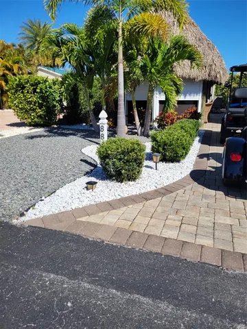 a view of a backyard with couches and trees