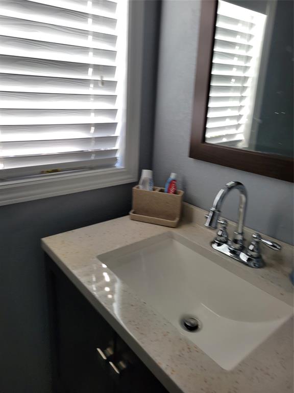 511 Southwest 39th Trace Okeechobee, FL 34974 - Photo 12 of 16 a bathroom with a sink