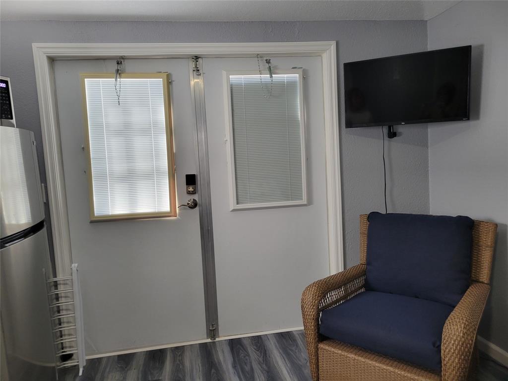 511 Southwest 39th Trace Okeechobee, FL 34974 - Photo 14 of 16 a living room with furniture and a flat screen tv