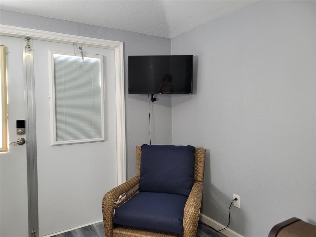 511 Southwest 39th Trace Okeechobee, FL 34974 - Photo 15 of 16 a living room with furniture and a flat screen tv