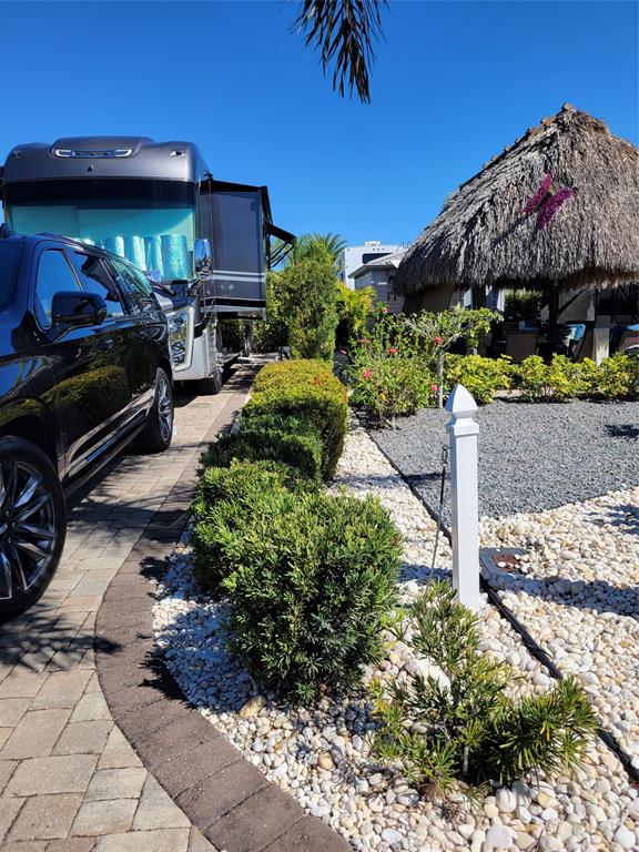 511 Southwest 39th Trace Okeechobee, FL 34974 - Photo 2 of 16 a view of a chairs and table in a backyard