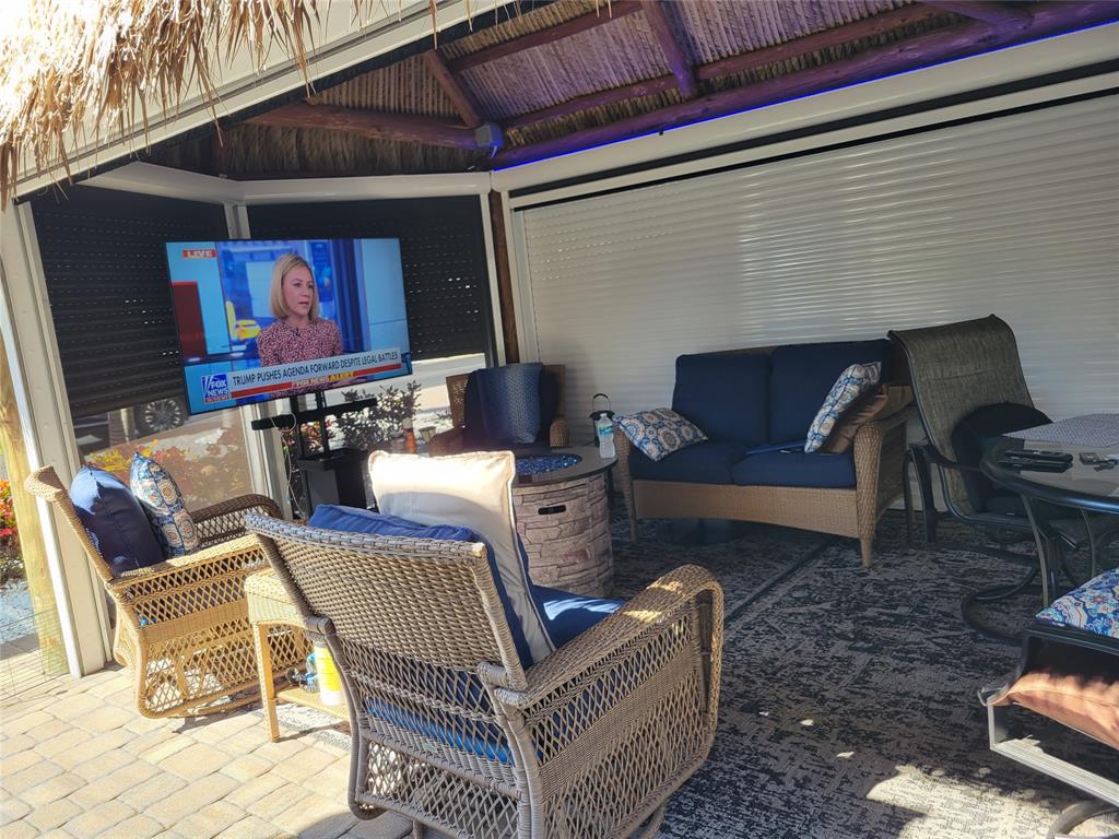 511 Southwest 39th Trace Okeechobee, FL 34974 - Photo 7 of 16 a view of a patio with couches chairs and a table