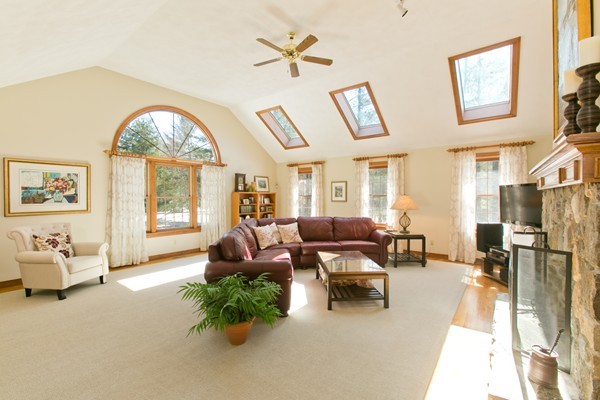 160 Elizabeth Ridge Road Carlisle, MA 01741 - Photo 11 of 23 a living room with furniture fireplace and a large window
