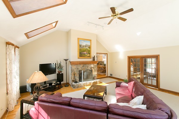 160 Elizabeth Ridge Road Carlisle, MA 01741 - Photo 12 of 23 a living room with furniture fireplace and a flat screen tv