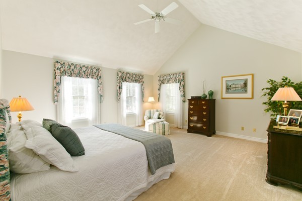 160 Elizabeth Ridge Road Carlisle, MA 01741 - Photo 18 of 23 a bedroom with a bed and a flat tv screen on dresser