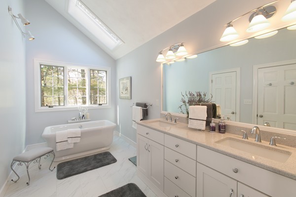 160 Elizabeth Ridge Road Carlisle, MA 01741 - Photo 19 of 23 a spacious bathroom with a granite countertop sink a toilet a mirror and shower