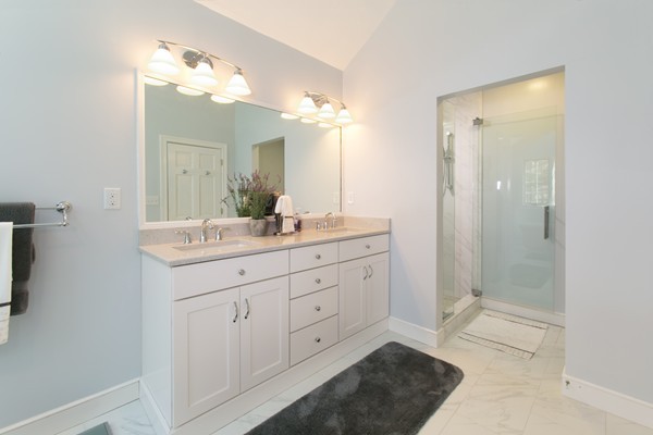160 Elizabeth Ridge Road Carlisle, MA 01741 - Photo 20 of 23 a bathroom with a double vanity sink mirror and shower