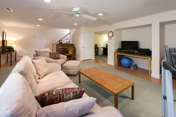 160 Elizabeth Ridge Road Carlisle, MA 01741 - Photo 21 of 23 a living room with furniture and a flat screen tv