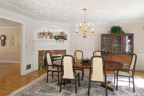 160 Elizabeth Ridge Road Carlisle, MA 01741 - Photo 7 of 23 a dining room with furniture a chandelier and wooden floor