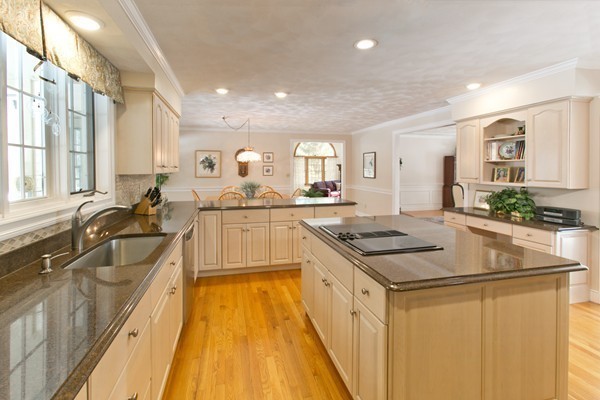 160 Elizabeth Ridge Road Carlisle, MA 01741 - Photo 8 of 23 a kitchen with stainless steel appliances granite countertop a sink stove and cabinets