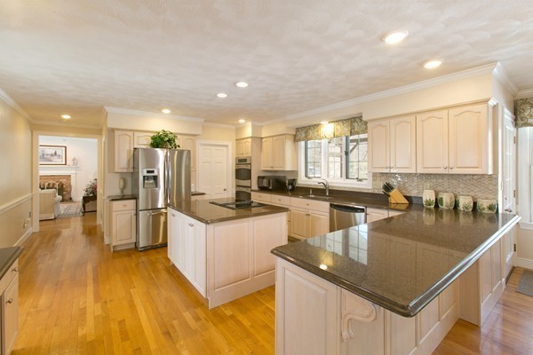 160 Elizabeth Ridge Road Carlisle, MA 01741 - Photo 9 of 23 a kitchen with stainless steel appliances granite countertop a sink a stove and refrigerator