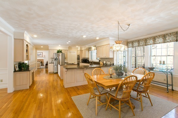 160 Elizabeth Ridge Road Carlisle, MA 01741 - Photo 10 of 23 a view of a dining room with furniture wooden floor and a chandelier