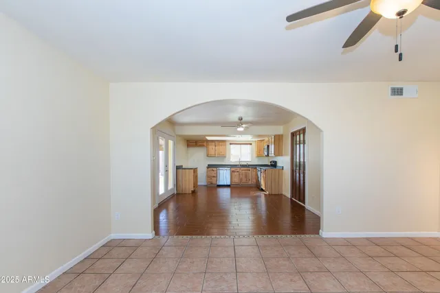 a kitchen with stainless steel appliances granite countertop a stove a microwave and a sink