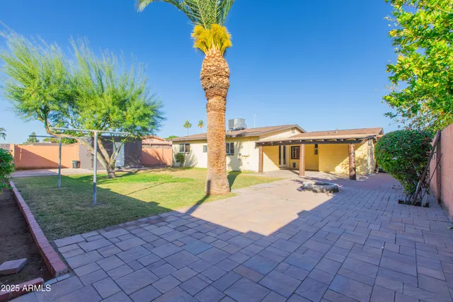 an aerial view of residential house with outdoor space and swimming pool