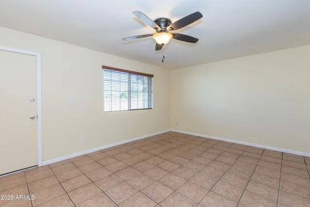a view of a kitchen with kitchen island stainless steel appliances refrigerator sink and cabinets